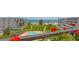 Balcony view featuring a pool, manicured lawns, beach and ocean at 1465 Gulf Of Mexico Dr # 502, Longboat Key, FL 34228