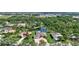Scenic aerial view of home and lush landscaping with a serene pond in a desirable neighborhood at 15006 21St E Ave, Bradenton, FL 34212
