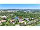 Drone shot of the house with pond views highlighting prime location and lush landscape at 15006 21St E Ave, Bradenton, FL 34212