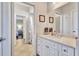 Bathroom featuring tile floors, a marble countertop, and a decorative mirror at 15006 21St E Ave, Bradenton, FL 34212