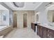 Spacious bathroom with separate vanities, soaking tub, and walk-in shower at 15006 21St E Ave, Bradenton, FL 34212