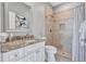This bathroom features a tiled shower and granite countertops at 15006 21St E Ave, Bradenton, FL 34212