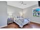 Cozy bedroom with wood floors, ceiling fan, and natural light at 15006 21St E Ave, Bradenton, FL 34212