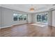 The bedroom includes a ceiling fan, a large window and sliding glass door to the pool at 15006 21St E Ave, Bradenton, FL 34212