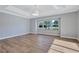 This bedroom includes a ceiling fan, tray ceilings and a large picture window at 15006 21St E Ave, Bradenton, FL 34212