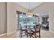 Bright dining area with a glass table and views of the pool at 15006 21St E Ave, Bradenton, FL 34212