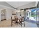Bright dining area with glass table and views of the patio and pool at 15006 21St E Ave, Bradenton, FL 34212