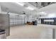The large garage features painted floors and plenty of storage at 15006 21St E Ave, Bradenton, FL 34212