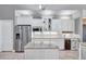 Bright kitchen features stainless steel appliances, granite countertops, and custom cabinetry at 15006 21St E Ave, Bradenton, FL 34212