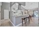 Spacious kitchen with granite countertops, stainless appliances, and breakfast bar at 15006 21St E Ave, Bradenton, FL 34212