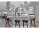 Open kitchen with granite countertops, breakfast bar seating, and stainless steel appliances at 15006 21St E Ave, Bradenton, FL 34212