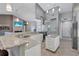 Gourmet kitchen with granite countertops, stainless steel appliances, and center island at 15006 21St E Ave, Bradenton, FL 34212
