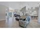 Bright living room with vaulted ceilings seamlessly connects to kitchen and dining areas at 15006 21St E Ave, Bradenton, FL 34212