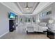 Main bedroom featuring backyard views and decorative tray ceilings at 15006 21St E Ave, Bradenton, FL 34212