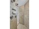 Walk-in shower featuring neutral tones, tile accents, and shelving at 15006 21St E Ave, Bradenton, FL 34212