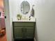 Bathroom vanity featuring a modern mirror, quartz countertop, and gold hardware at 15207 Searobbin Dr, Lakewood Ranch, FL 34202