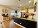 Bright kitchen featuring granite countertops, stainless steel appliances, and a kitchen island with a sink at 15207 Searobbin Dr, Lakewood Ranch, FL 34202