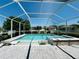 Backyard pool with attached spa and shallow tanning ledge surrounded by brick pavers at 15207 Searobbin Dr, Lakewood Ranch, FL 34202