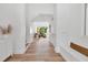 Bright hallway with hardwood floors and an open view of the cozy living area at 1642 Arlington St, Sarasota, FL 34239
