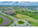 Picturesque aerial view of a Primary-planned community featuring lush green spaces, ponds, and walking trails at 17122 Ranchside Pl, Bradenton, FL 34211