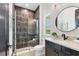 Beautiful bathroom with a glass-enclosed shower and elegant black fixtures at 17122 Ranchside Pl, Bradenton, FL 34211