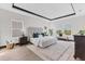 Spacious bedroom features a plush bed, lots of natural light, and stylish decor for a relaxing and comfortable ambiance at 17122 Ranchside Pl, Bradenton, FL 34211