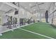 State-of-the-art fitness center features a turf area, high ceilings, and various exercise machines at 17122 Ranchside Pl, Bradenton, FL 34211