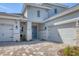 Charming two-story home featuring a two-car garage, stone accents, and professionally landscaped yard at 17122 Ranchside Pl, Bradenton, FL 34211