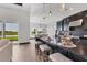 Modern kitchen with a spacious island, pendant lighting, and an adjacent dining area with scenic views at 17122 Ranchside Pl, Bradenton, FL 34211