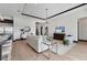 Cozy living room with plush seating, modern lighting, and views of the lake at 17122 Ranchside Pl, Bradenton, FL 34211