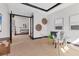Inviting home office space with glass door entry, neutral decor, and a comfortable setting with a calming ambiance at 17122 Ranchside Pl, Bradenton, FL 34211