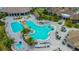 A resort-style pool featuring a beach entry, water slide, and plenty of spots to lay out in the sun at 17704 Gawthrop Dr # 303, Lakewood Ranch, FL 34211