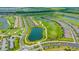 Gorgeous aerial view of the golf course with its beautiful pond and homes surrounding the green at 17704 Gawthrop Dr # 303, Lakewood Ranch, FL 34211