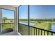 Relaxing screened balcony featuring serene views of the lake and the golf course at 17704 Gawthrop Dr # 303, Lakewood Ranch, FL 34211