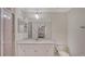 Bright bathroom with a modern vanity, a large mirror, and a tiled walk-in shower at 17704 Gawthrop Dr # 303, Lakewood Ranch, FL 34211