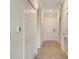 Hallway with tile flooring and white doors at 17704 Gawthrop Dr # 303, Lakewood Ranch, FL 34211