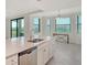 Bright kitchen with quartz countertops and stainless steel dishwasher at 17704 Gawthrop Dr # 303, Lakewood Ranch, FL 34211