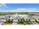Stunning aerial view of the homes and water feature in the community at 18510 Midsummer Pl, Venice, FL 34293