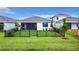 Spacious fenced backyard with lush green grass, ready for outdoor enjoyment at 18510 Midsummer Pl, Venice, FL 34293