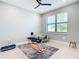 Bedroom with ceiling fan, natural light and room for working out at 18510 Midsummer Pl, Venice, FL 34293