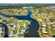 Expansive aerial showcases the community's canal-front homes, blending waterfront living with lush landscapes at 1921 Fairview Dr, Englewood, FL 34223