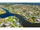 Stunning aerial perspective of waterfront homes with canals, boat docks, and serene neighborhood at 1921 Fairview Dr, Englewood, FL 34223