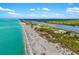Stunning aerial view of the beach and waterfront homes at 1921 Fairview Dr, Englewood, FL 34223