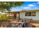 View of backyard with covered porch, greenery, and exterior of home at 1921 Fairview Dr, Englewood, FL 34223