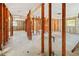 Spacious basement undergoing renovation, showcasing its potential with exposed beams and ample natural light at 1921 Fairview Dr, Englewood, FL 34223