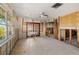 Bright dining room featuring exposed walls and double doors to the backyard at 1921 Fairview Dr, Englewood, FL 34223