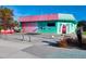 Unique coral and teal building with colorful flamingo art located at 342 Dearborn Street at 1921 Fairview Dr, Englewood, FL 34223