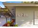 Close-up on the house number '1921' adds a personal touch to this charming home's exterior at 1921 Fairview Dr, Englewood, FL 34223