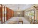 Spacious room featuring exposed walls and bright light from the multiple windows at 1921 Fairview Dr, Englewood, FL 34223