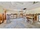 Large room featuring exposed walls, ceiling lights and view into adjoining rooms at 1921 Fairview Dr, Englewood, FL 34223